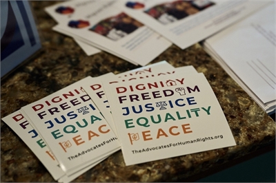 Stickers reading Dignity Freedom Justice Equality Peace 